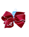 Red hair bow with white trim and a logo on a white background