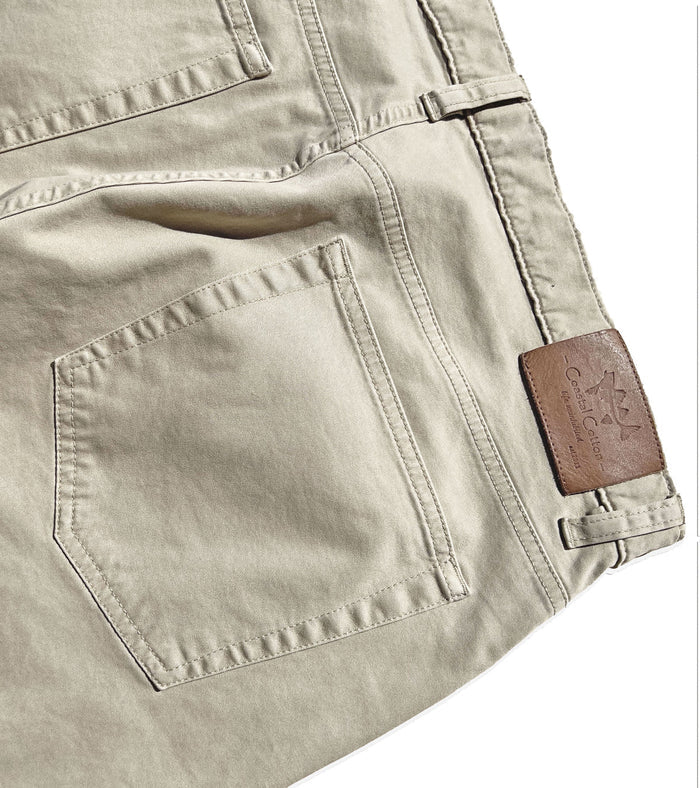 khaki pants showing a CC logo
