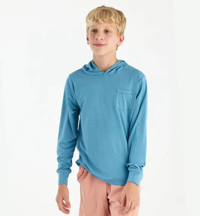 boy wearing a blue hoodie