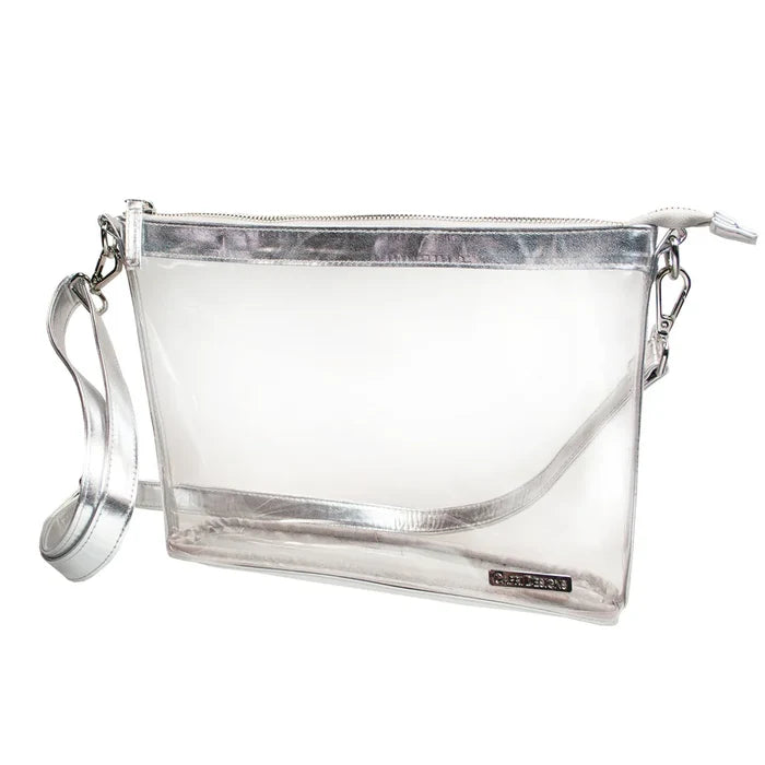 Clear handbag with silver interior and handle on a white background