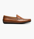 Brown leather loafer shoe on a white background