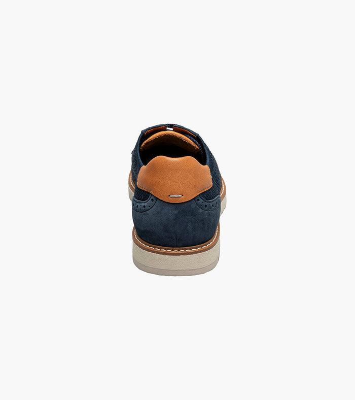 Blue shoe with brown heel on a white background