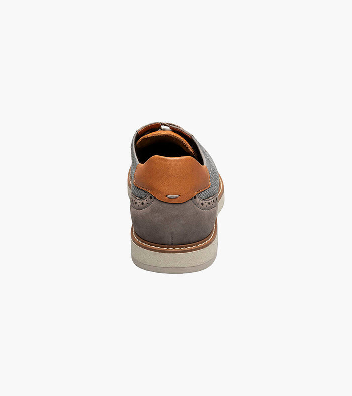 grey shoe with brown heel on a white background