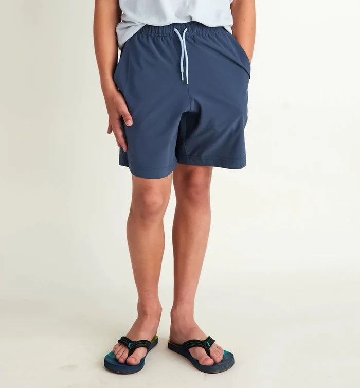boy wearing navy shorts