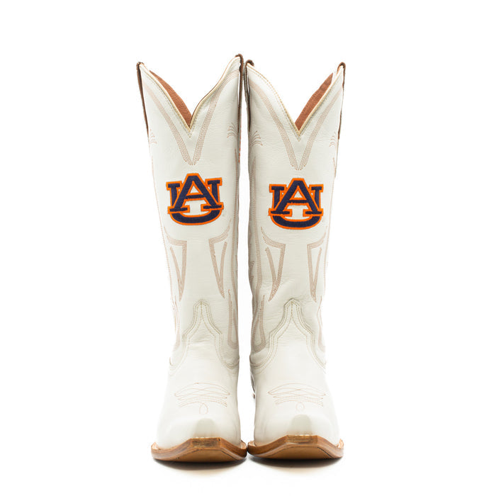 A pair of white women's western boots with embroidered team logos and a wood heel, designed for gameday attire.