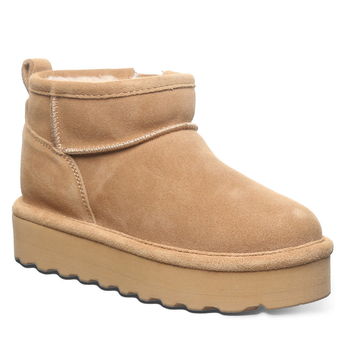 A brown suede youth boot with a layered EVA midsole and a wool blend lining, featuring a lightweight blown rubber outsole.