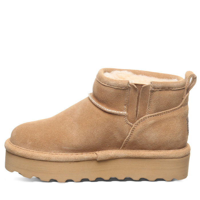 A brown suede youth boot with a layered EVA midsole and a wool blend lining, featuring a lightweight blown rubber outsole.