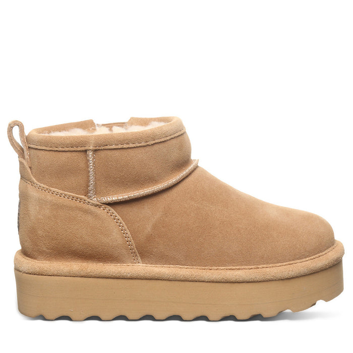 A brown suede youth boot with a layered EVA midsole and a wool blend lining, featuring a lightweight blown rubber outsole.