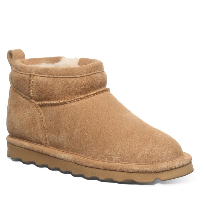 Tan suede ankle boot on a white background