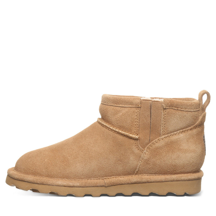 Tan suede ankle boot on a white background