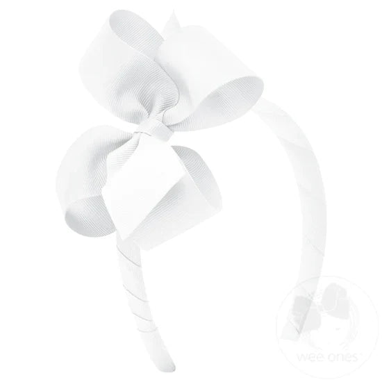 White bow and headband combo on a white background.