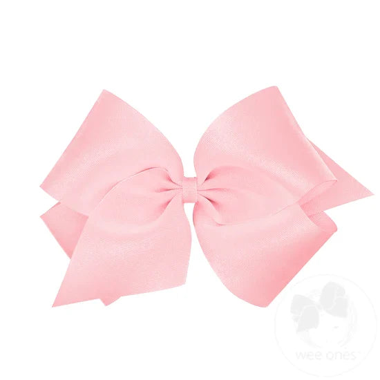 Large pink bow on a white background