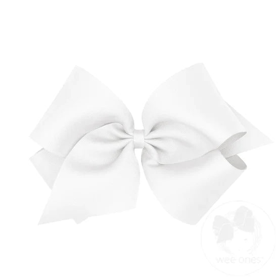 A large white hair bow with a grosgrain ribbon and a knot in the center.