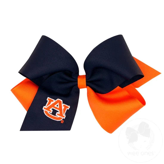 A large two-tone hair bow with a collegiate logo embroidered on it, primarily in maroon and white colors.