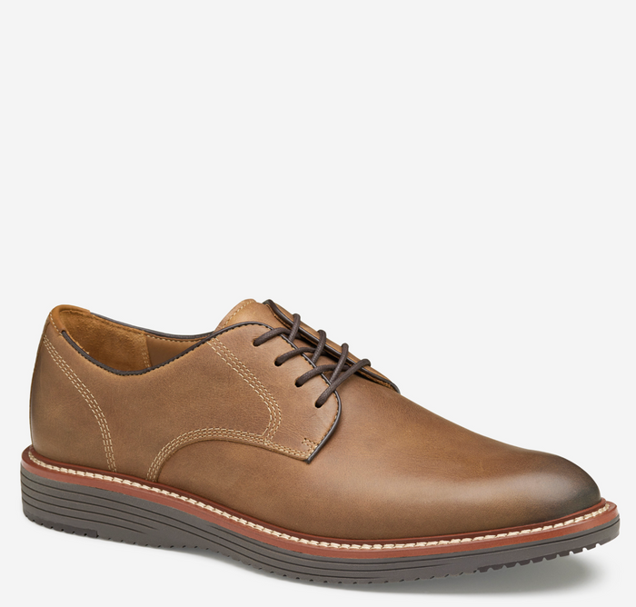 Brown leather shoe on a white background