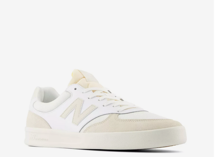 A pair of New Balance CT300 sneakers with a white mesh fabric, leather & suede upper, and a rubber sole.