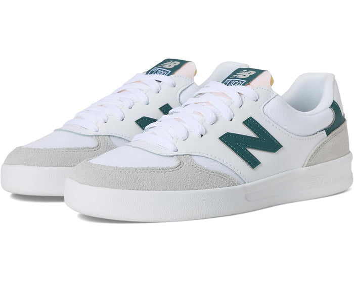 White sneakers with green accents on a white background