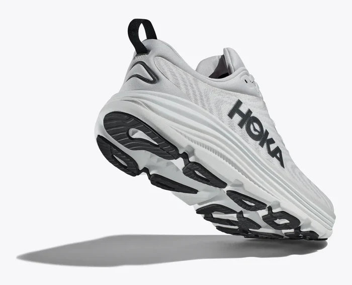 White running shoe with 'Hoka' branding on a white background