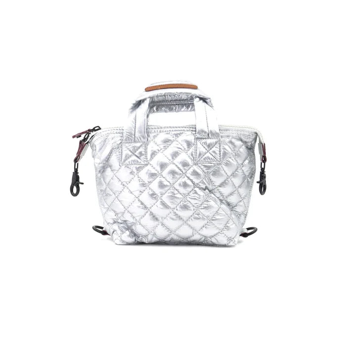 A silver quilted nylon crossbody bag with a detachable strap and a zipper closure.