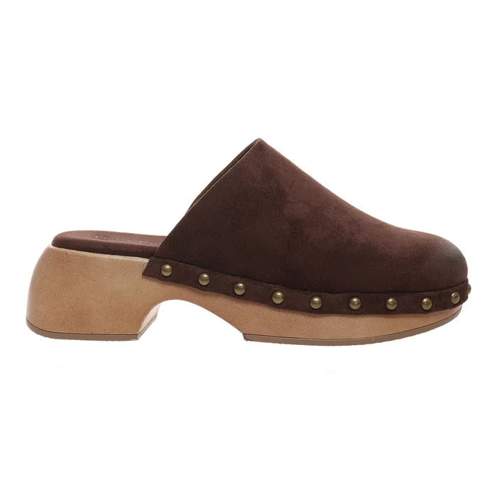 A dark brown suede clog shoe with a chunky light tan wooden platform sole and decorative brass studs along the side, shown in profile against a white background.