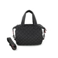 A quilted black crossbody bag with a removable strap, displayed against a plain background.