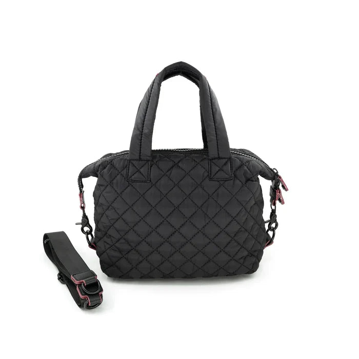 A quilted black crossbody bag with a removable strap, displayed against a plain background.