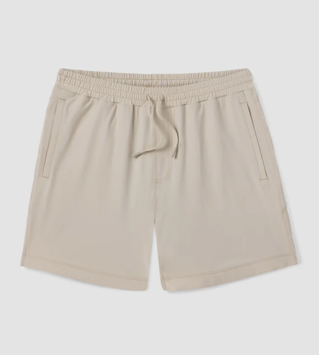 Beige shorts with an elastic waistband on a light gray background