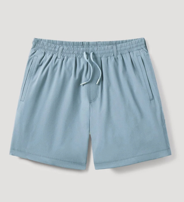 blue shorts with an elastic waistband on a light gray background
