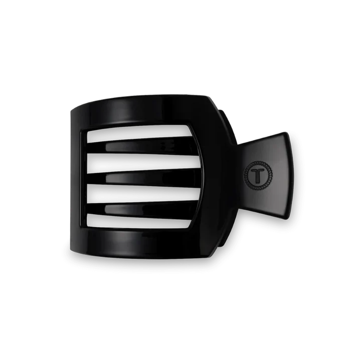 A black flat square hair clip made of plastic.