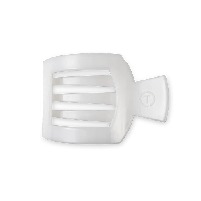 A white flat square hair clip made of plastic.
