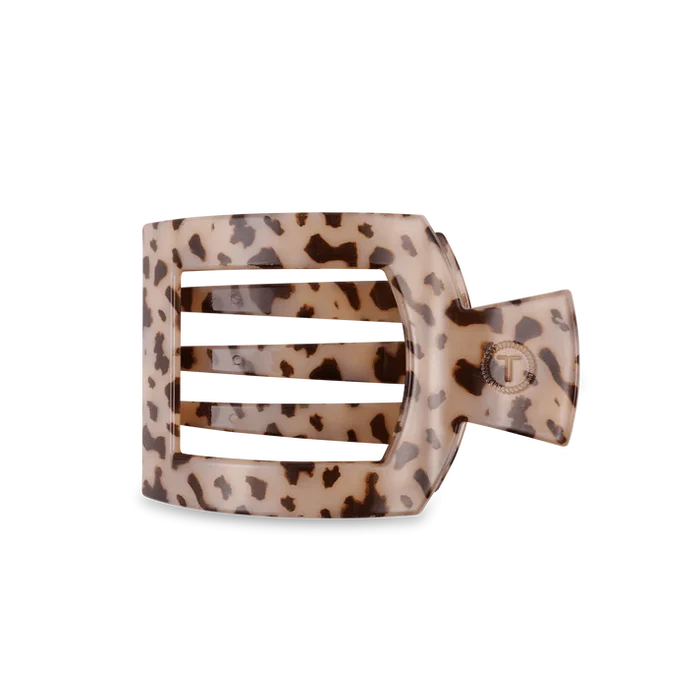 Leopard print hair clip on a white background