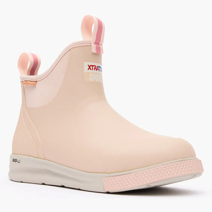 Pink rain boot with Xtratuf logo on a white background