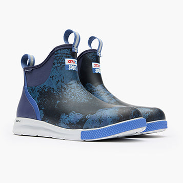 A pair of XtraTuf 6' ADB Sport M Boots for men, featuring a non-marking outsole, pull-on tabs, and a slip-resistant design in blue and black color.