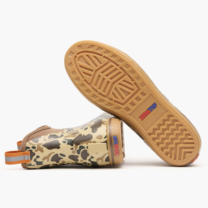 Camouflage-patterned sandal with a tan sole on a white background