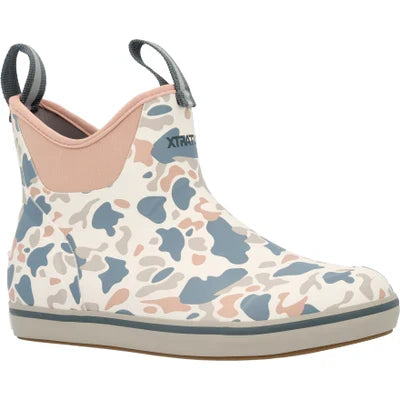 A pink slip-on rubber fishing boot for women with hand laid rubber overlays and a Chevron outsole.