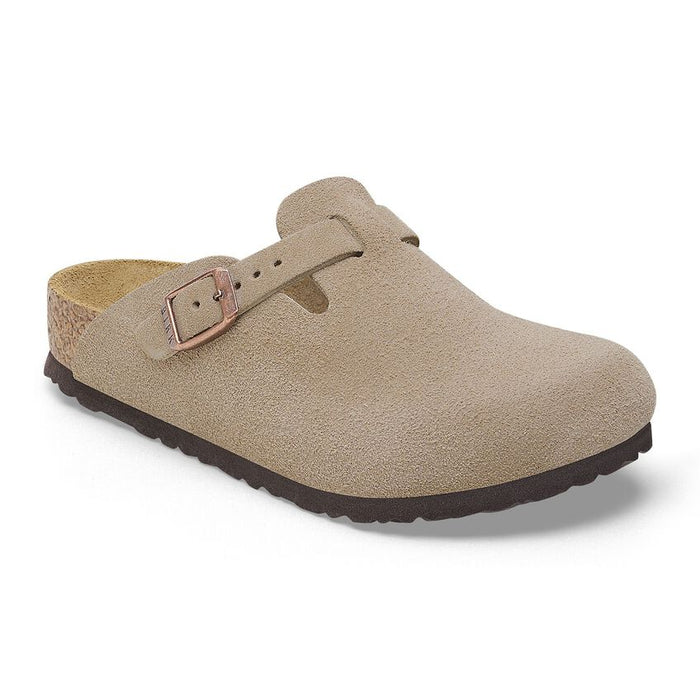Beige clog shoe with a strap and buckle on a white background